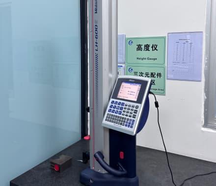Large blue metal frame scanned by a robotic arm with blue-light 3D laser scanner