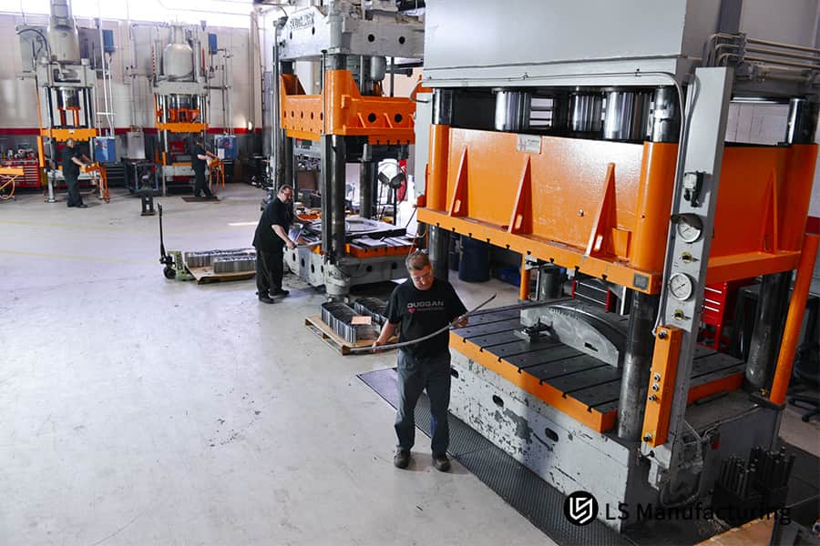 Forming a long cold rolled steel connector bracket on a hydraulic press for automotive or machinery assembly.