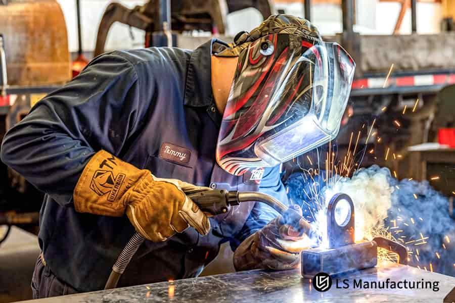 A welder joins 6061 aluminum frame parts for automated machinery with a pulsed MIG welding process.
