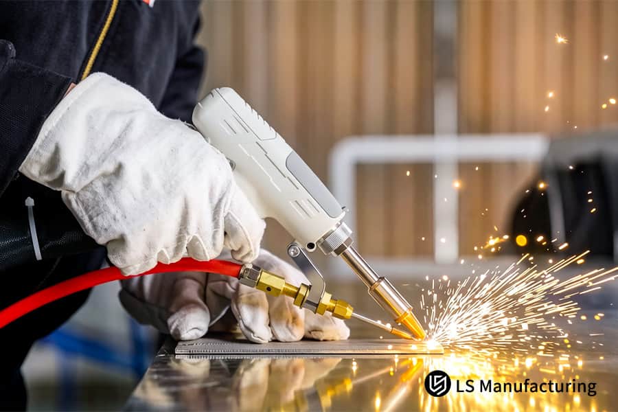A technician uses a handheld laser to weld a steel sheet for automotive body or electronic enclosure assembly.