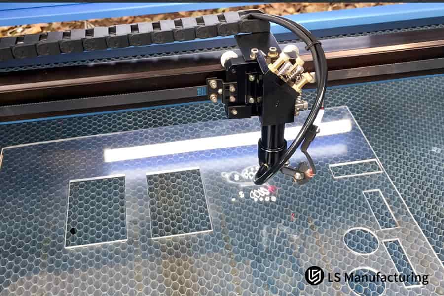 Cutting holes in clear acrylic sheet for point-of-sale displays or prototype model components.