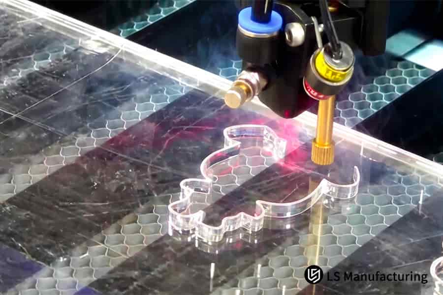 Laser cutting fabricates complex internal features in thick acrylic for architectural signage components.