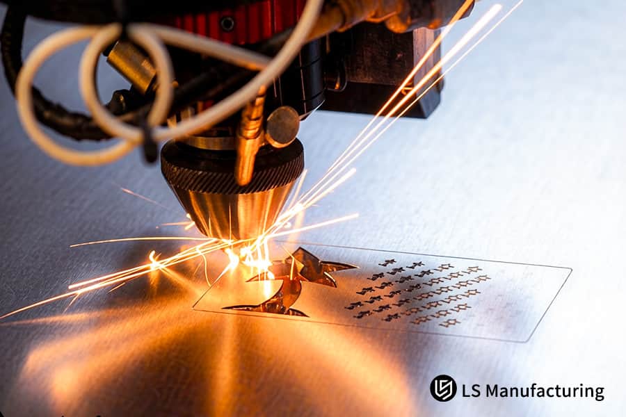 Laser cutting machine carves star patterns on 304 stainless steel sheet for electronic device decoration.